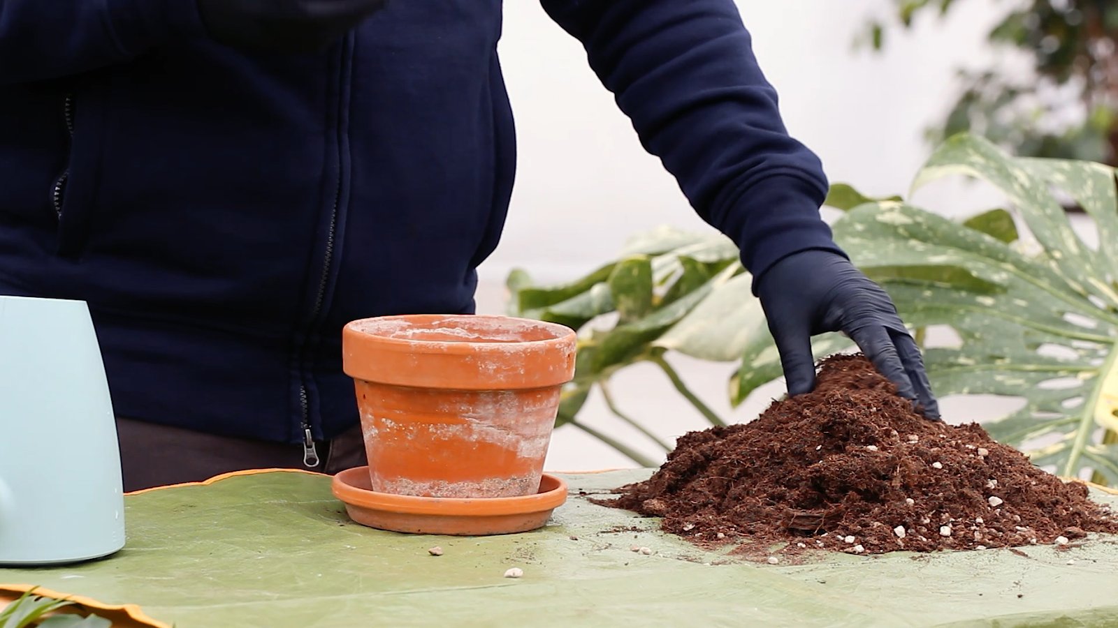 Terracotta pot with one plus soil next to it with coarse aggregates which increase drainage