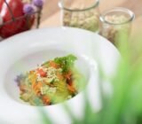 Vegetable pan with buckwheat sprouts and garlic dressing