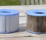 How can I clean the filter cartridge of my Intex inflatable spa?